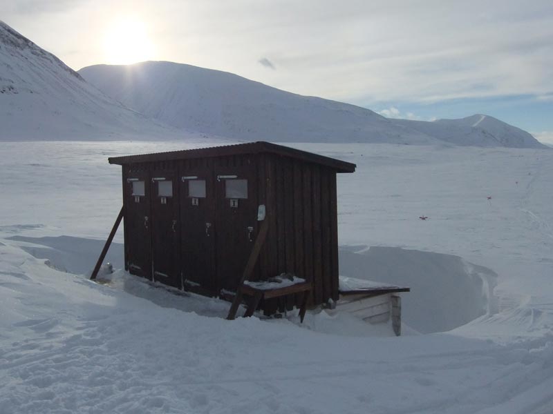 A loo with a view! Dog sledding on the King's Trail in Sweden. Photo: Nature Travels.