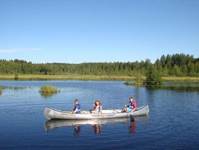 Canoeing on the lakes at the cabins | Photo: John Hartshorn