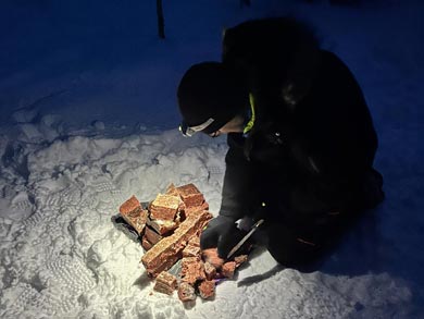 Chopping meat for the dogs | Photo: LND