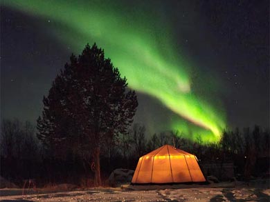 Northern Lights over the tent during the tour | Photo: PIR